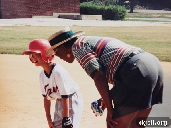 Brett Gordon being coached by Ernie Banks at his little league game.